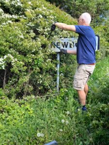 Cllr Fountain trimming parish hedges