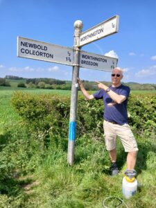Cllr. C Fountain Stood next to a clean sign